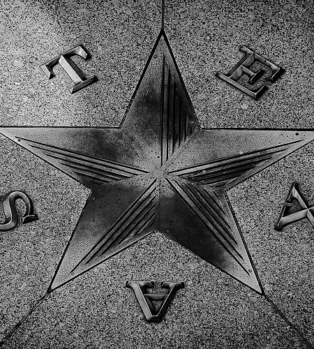 Star embedded in textured stone surface.