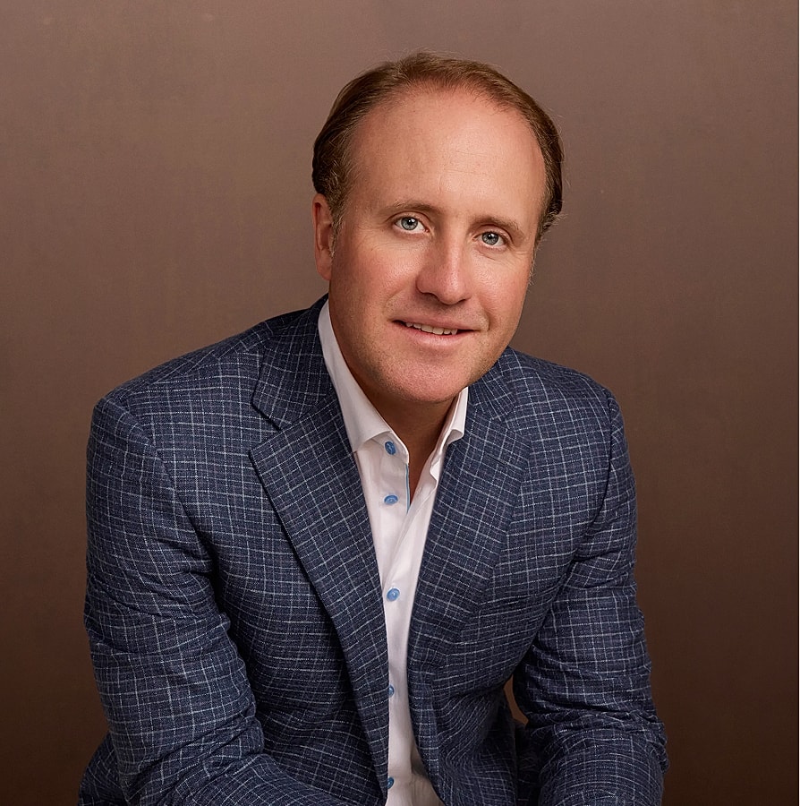 Professional portrait of a businessman in suit.