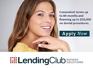 Smiling woman promoting dental financing options