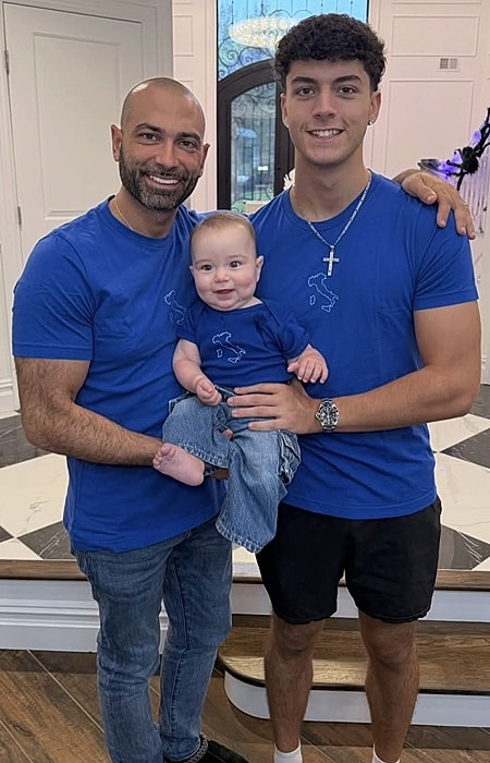 Three family members in matching blue shirts.