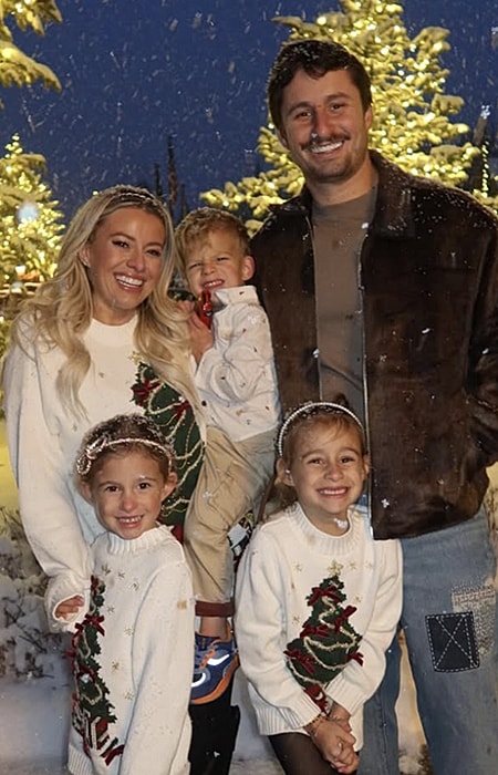 Family portrait in winter holiday sweaters.