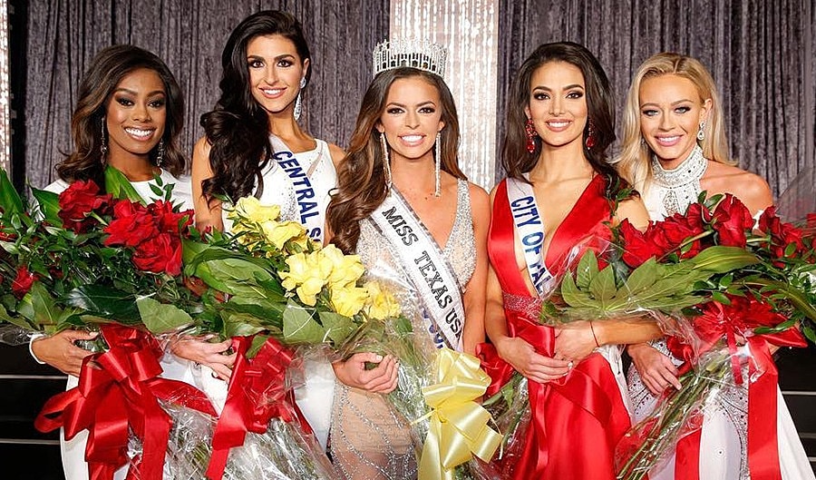 Beauty pageant winners with crowns and bouquets.